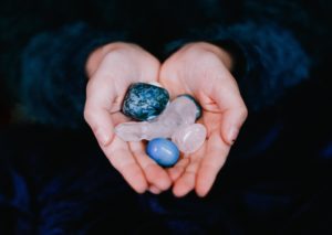 Crystals being held in a womans hand